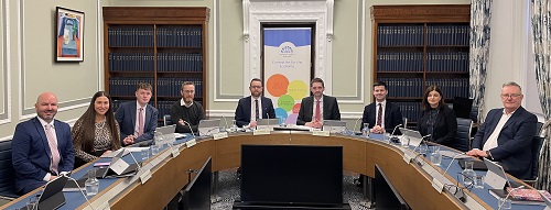 The Committee for the Economy pose around the table before the meeting commences