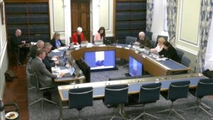 The Justice Committee sitting in a committee room at Parliament Buildings