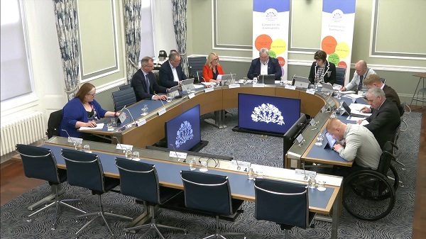 The Committee for Communities sitting in a committee room at Parliament Buildings