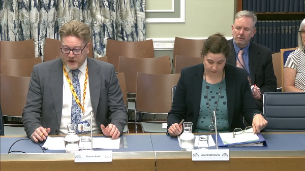 Departmental Officials sitting in a committee room in Parliament Buildings