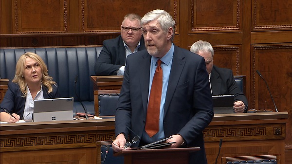 The Minister for Infrastructure speaking in the Assembly Chamber