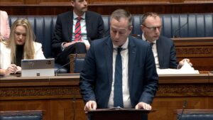 The Minister for Education speaking in the Assembly Chamber