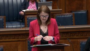 Finance Minister Caoimhe Archibald speaking in the Assembly Chamber