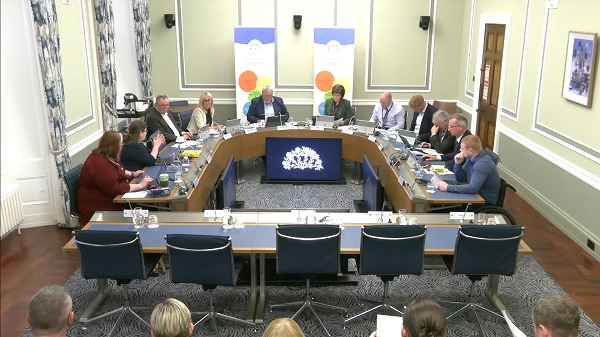 The Committee for Communities sitting in a committee room in Parliament Buildings