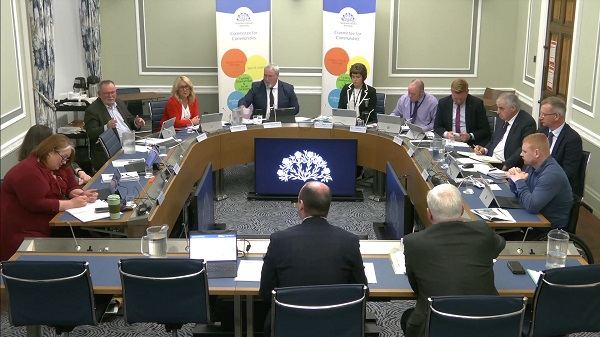The Committee for Communities sitting in a committee room at Parliament Buildings
