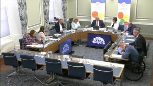 The Committee for Communities sitting in a committee room at Parliament Buildings