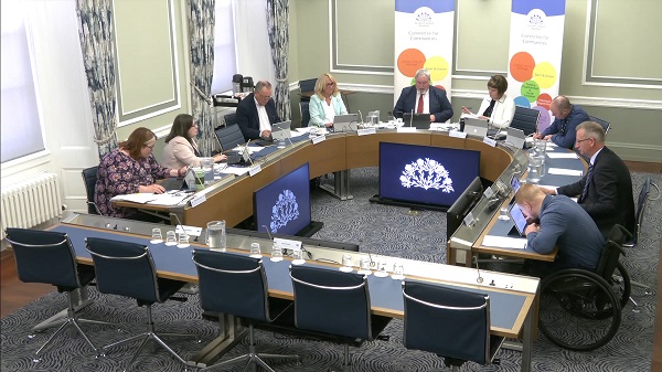 The Committee for Communities sitting in a committee room at Parliament Buildings