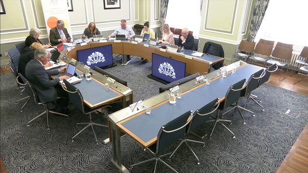 Members of the Committee for Agriculture, Environment and Rural Affairs sitting in a committee room in Parliament Buildings