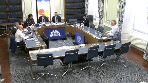 The Committee for the Economy sitting in a committee room in Parliament Buildings