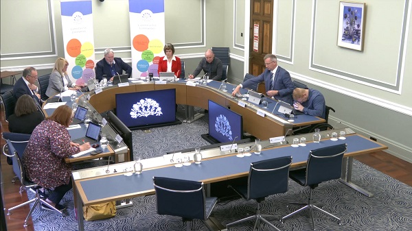 The Committee for Communities sitting in a committee room at Parliament Buildings