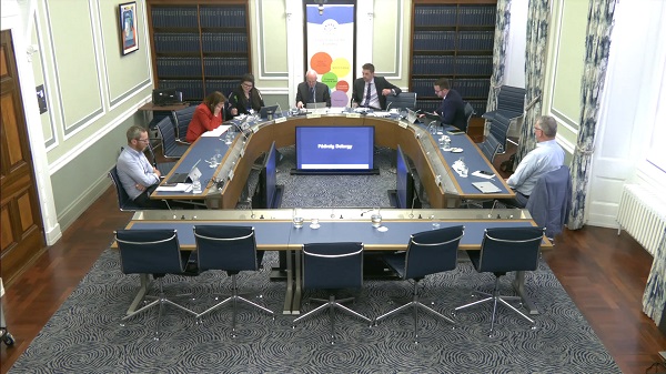 The Committee for the Economy sitting in a committee room in Parliament Buildings