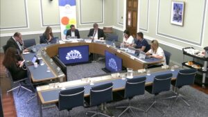 Members of the Committee for Education sitting in a committee room in Parliament Buildings