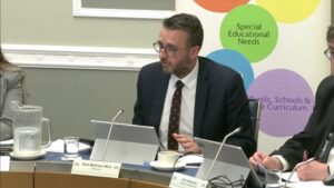 Committee Chair Nick Mathison sitting in a committee room in Parliament Buildings