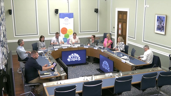 Members of the Committee for Health sitting in a committee room in Parliament Buildings