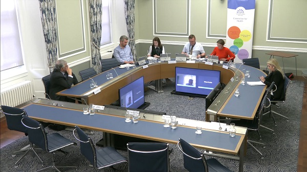 Members of the Committee for Health sitting in a committee room in Parliament Buildings