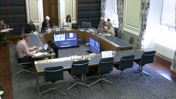 Members of the Committee for Justice sitting in a committee room in Parliament Buildings