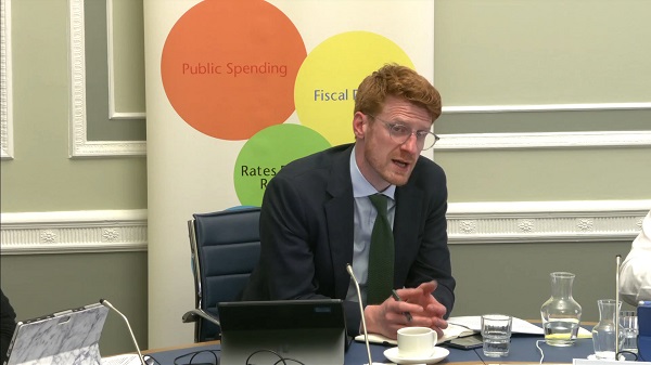 Committee Chair Matthew O'Toole sitting in a committee room in Parliament Buildings