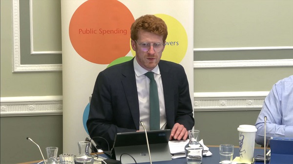 Committee Chair Matthew O'Toole sitting in a committee room in Parliament Buildings