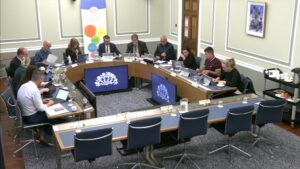 Members of the Education Committee sitting in a committee room in Parliament Buildings
