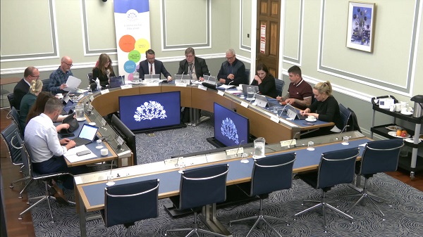 Members of the Education Committee sitting in a committee room in Parliament Buildings