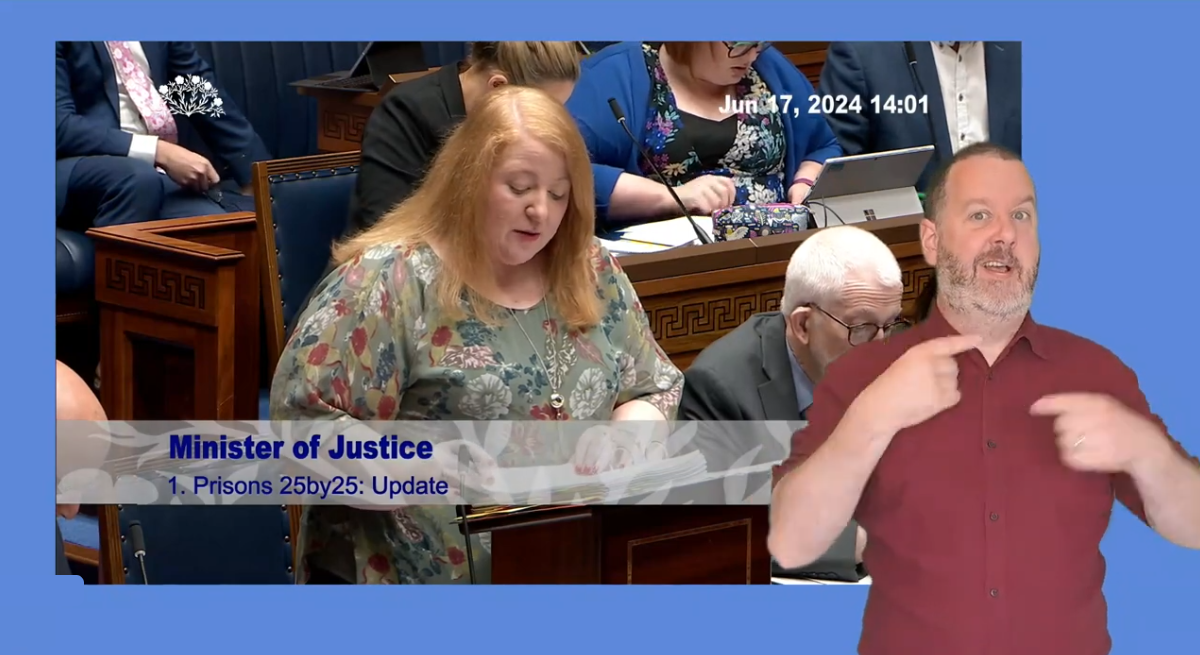 Minister of Justice, Naomi Long, answers Members questions during Question Time in the Assembly Chamber on Monday 17 June 2024. In the foreground and ISL interpreter interprets the audio .