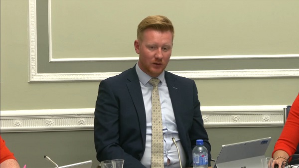 Chair of the Public Accounts Committee Daniel McCrossan sitting in a committee room at Parliament Buildings