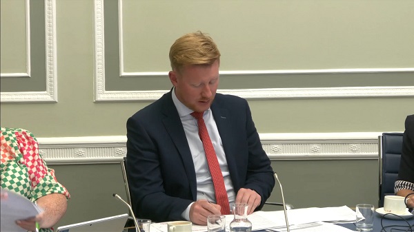 Chair of the Public Accounts Committee Daniel McCrossan sitting in a committee room at Parliament Buildings