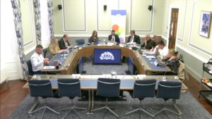 Members of the Committee for Education sitting in a committee room in Parliament Buildings