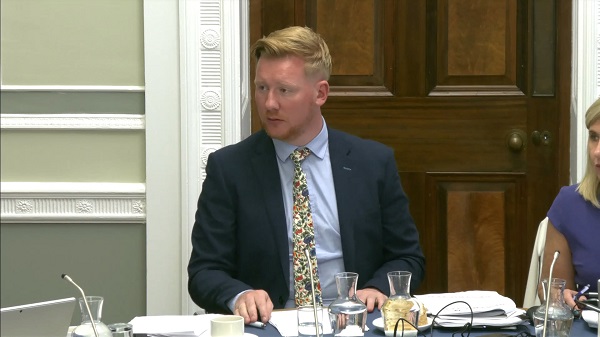 Chair of the Public Accounts Committee Daniel McCrossan sitting in a committee room at Parliament Buildings