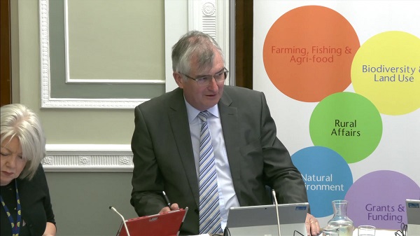 Chair of the Committee Tom Elliot sitting in a committee room at Parliament Buildings
