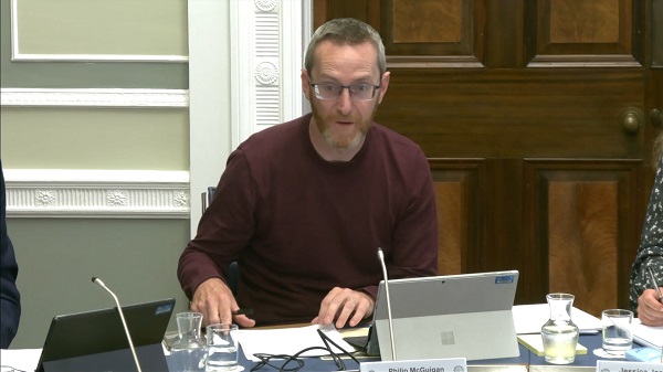 Committee Chair Philip McGuigan sitting in a committee room in Parliament Buildings