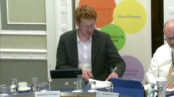Committee Chair Matthew O'Toole sitting in a committee room in Parliament Buildings