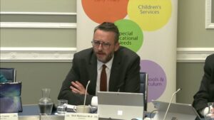 Committee Chair Nick Mathison sitting in a committee room in Parliament Buildings