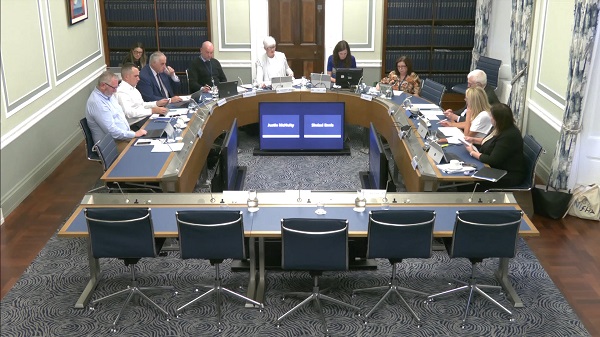 Members of Committee for Justice sitting in a committee room in Parliament Buildings