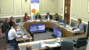 Members of Committee for Education sitting in a committee room in Parliament Buildings