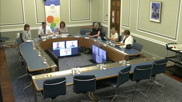 Members of Committee for Health sitting in a committee room in Parliament Buildings