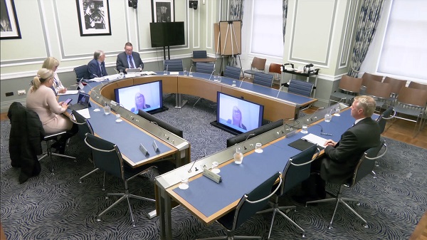 Members of the Audit Committee sitting in a committee room in Parliament Buildings