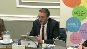 Committee Chair Nick Mathison sitting in a committee room in Parliament Buildings
