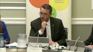 Committee Chair Nick Mathison sitting in a committee room in Parliament Buildings
