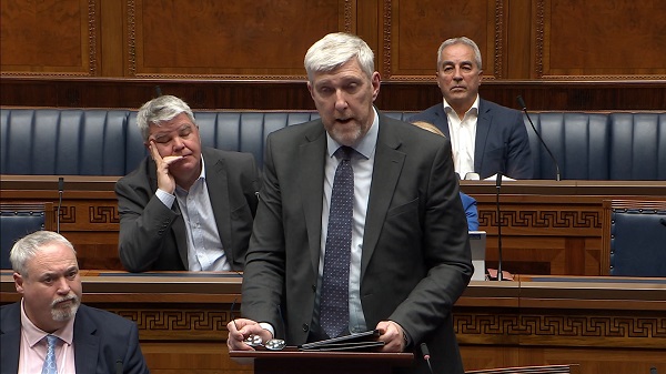 Infrastructure Minister John O'Dowd answers questions in the Assembly Chamber