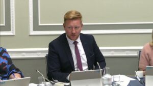 Chair of the Public Accounts Committee Daniel McCrossan sitting in a committee room at Parliament Buildings