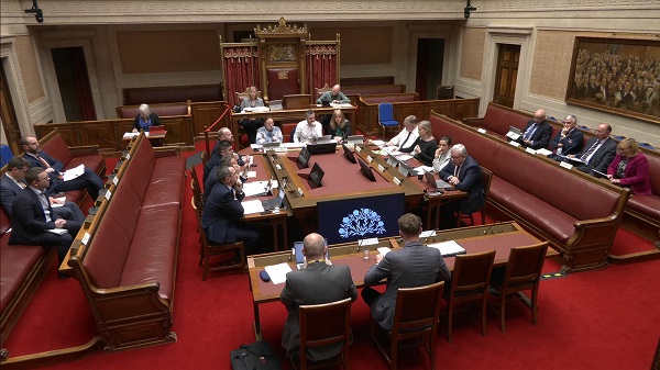 The Concurrent Committee sitting around a table in the Senate Chamber in Parliament Buildings. They are receiving a briefing from Ulster Farmers' Union.