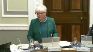 Chair of the Justice Committee Joanne Bunting sitting in a committee room at Parliament Buildings