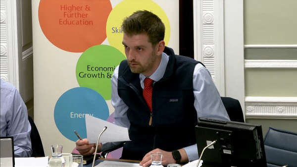 Economy Committee Chairperson Phillip Brett sitting in a committee room in Parliament Buildings