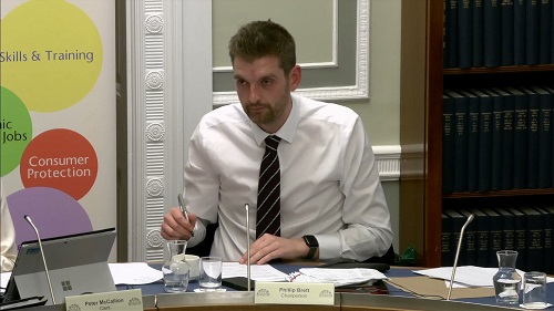Economy Committee Chairperson Phillip Brett sitting in a committee room in Parliament Buildings