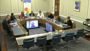 Members of the Education Committee sitting in a committee room in Parliament Buildings.