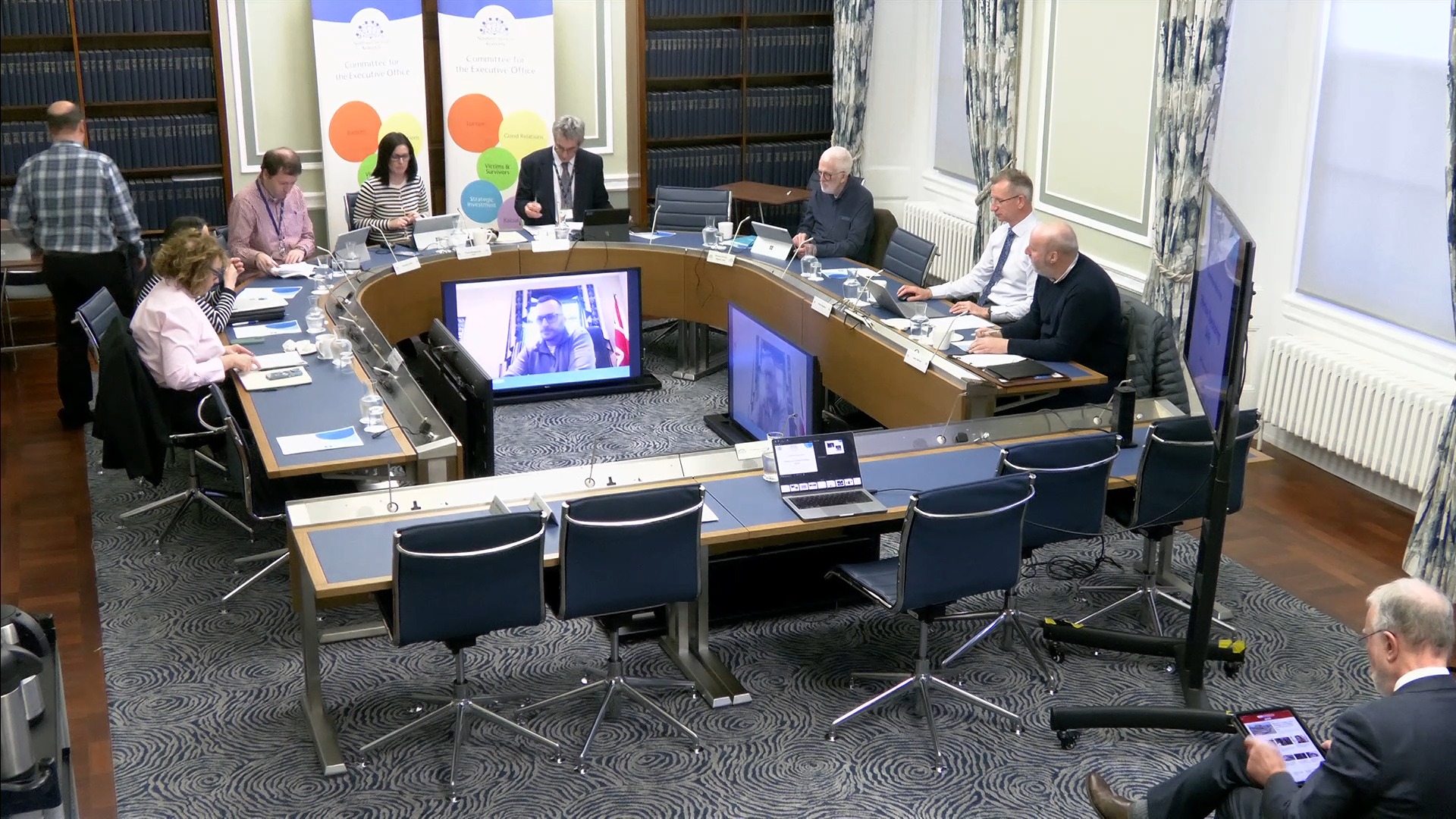 The Committee for the Executive Office at the start of a meeting in room 30, Parliament Buildings.