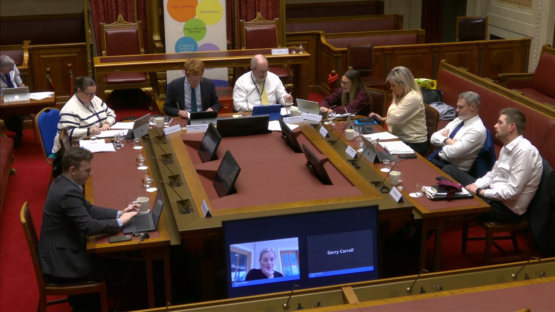 The Committee for Finance sitting around the table in the Senate Chamber at the beginning of its meeting on Wednesday 5 February 2025.