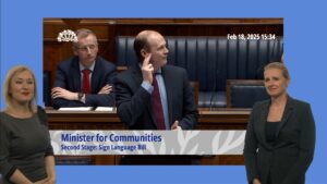 Minister for Communities Gordon Lyons opens the debate on the Sign Language Bill using sign language.